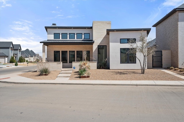 12001 Vicksburg Ave, Lubbock, TX 79424 - contemporary home with a porch, metal roof, and a standing seam roof