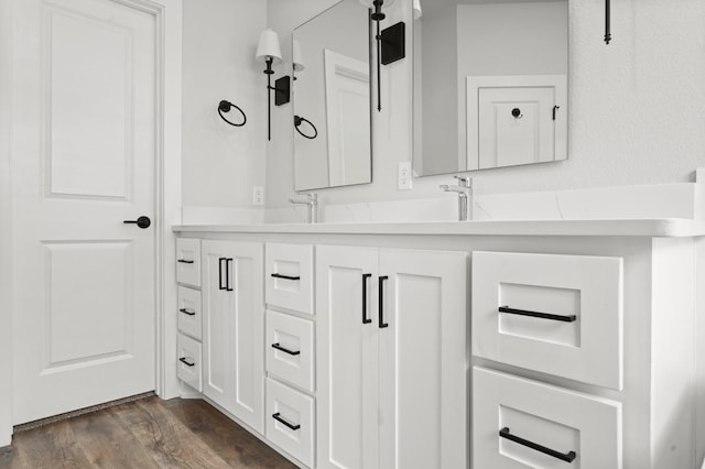 bathroom with vanity and hardwood / wood-style floors