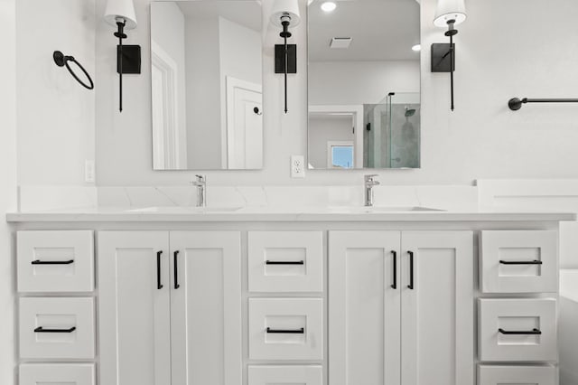 bathroom with vanity and an enclosed shower