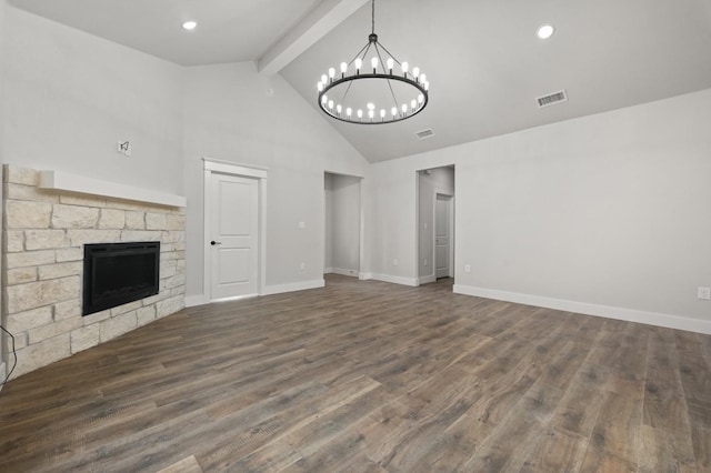 unfurnished living room featuring beam ceiling, high vaulted ceiling, dark hardwood / wood-style floors, a notable chandelier, and a fireplace