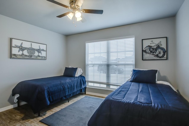 bedroom featuring ceiling fan and wood-type flooring