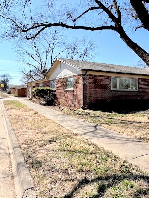 view of home's exterior with brick siding