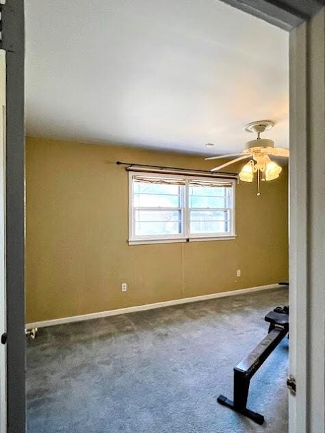 unfurnished room with carpet, ceiling fan, and baseboards