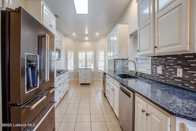 8 W Canyonview Dr, Ransom Canyon, TX 79366 - kitchen featuring stainless steel appliances, a sink, light tile patterned floors, decorative backsplash, and recessed lighting