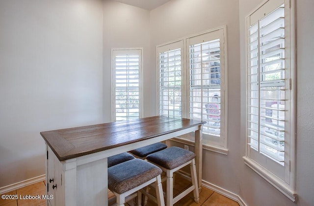 8 W Canyonview Dr, Ransom Canyon, TX 79366 - tiled dining room featuring plenty of natural light and baseboards