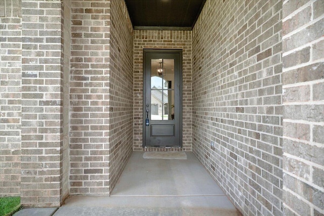 1406 Durham Ave, Wolfforth, TX 79382 - view of exterior entry featuring brick siding
