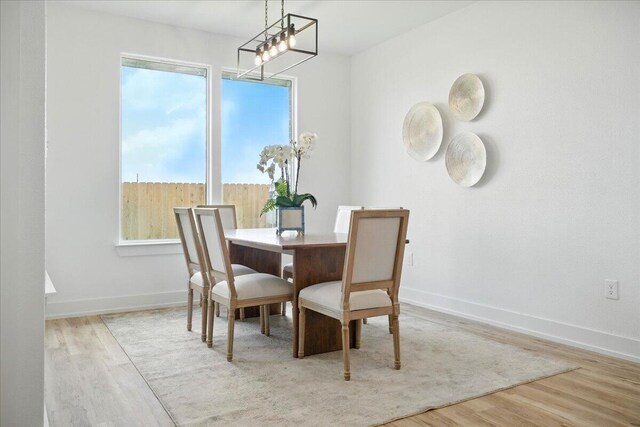 1406 Durham Ave, Wolfforth, TX 79382 - dining space with wood finished floors and baseboards