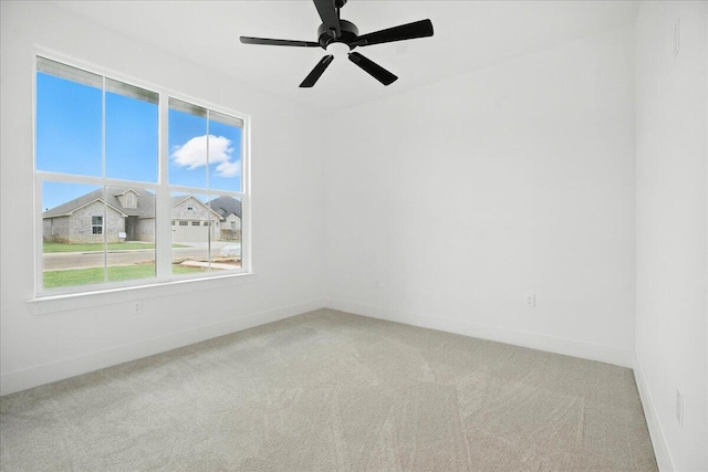 1406 Durham Ave, Wolfforth, TX 79382 - carpeted empty room featuring baseboards and a ceiling fan