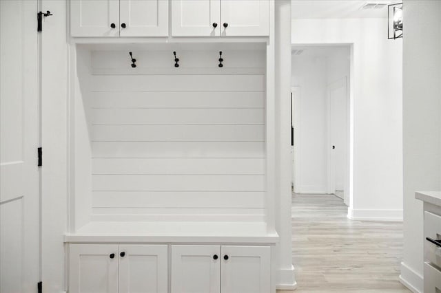 1406 Durham Ave, Wolfforth, TX 79382 - mudroom with light wood finished floors and baseboards
