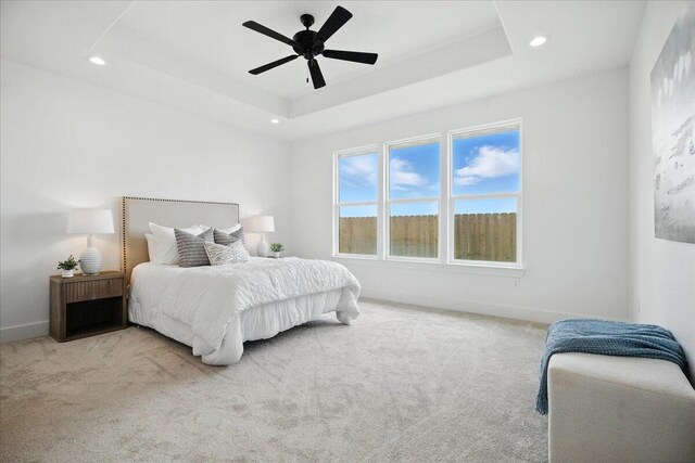 1406 Durham Ave, Wolfforth, TX 79382 - carpeted bedroom featuring recessed lighting, a tray ceiling, and ceiling fan