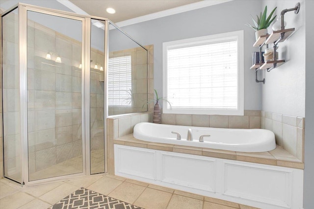 bathroom featuring plus walk in shower, ornamental molding, and tile patterned floors