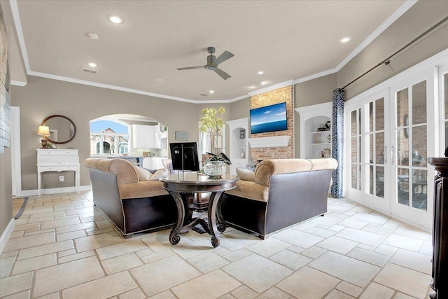 living room featuring crown molding, a brick fireplace, and ceiling fan