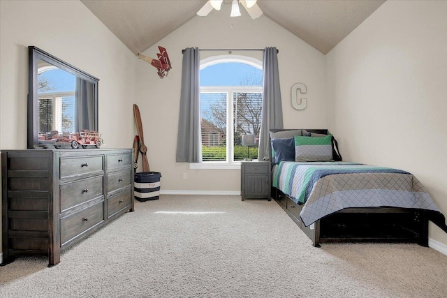 bedroom with lofted ceiling, light colored carpet, and ceiling fan