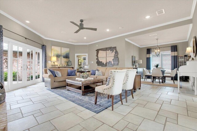 living room with crown molding and ceiling fan with notable chandelier