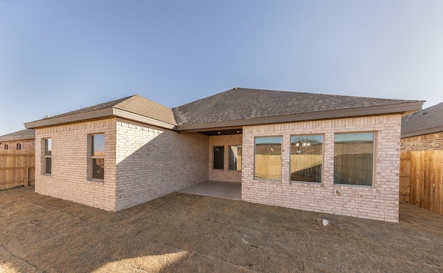 back of property featuring a patio