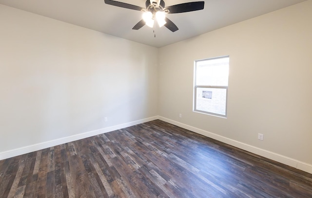 spare room with dark wood-type flooring and ceiling fan