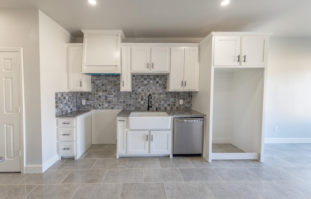 kitchen featuring sink, stainless steel dishwasher, white cabinets, and backsplash