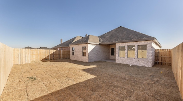 rear view of house featuring a patio