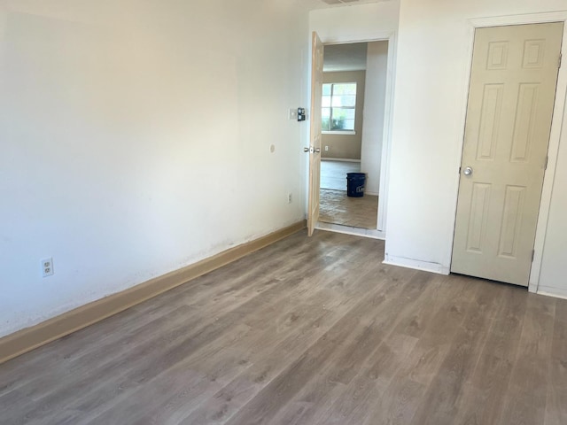 empty room featuring hardwood / wood-style floors