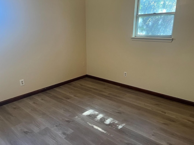 empty room featuring hardwood / wood-style flooring