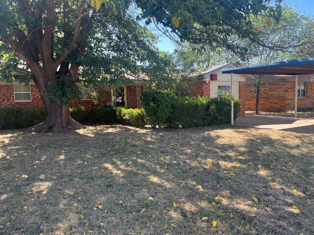 view of yard with a carport