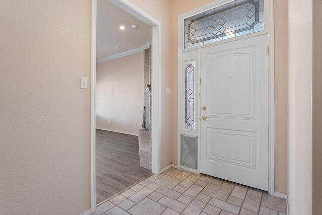 entrance foyer featuring crown molding