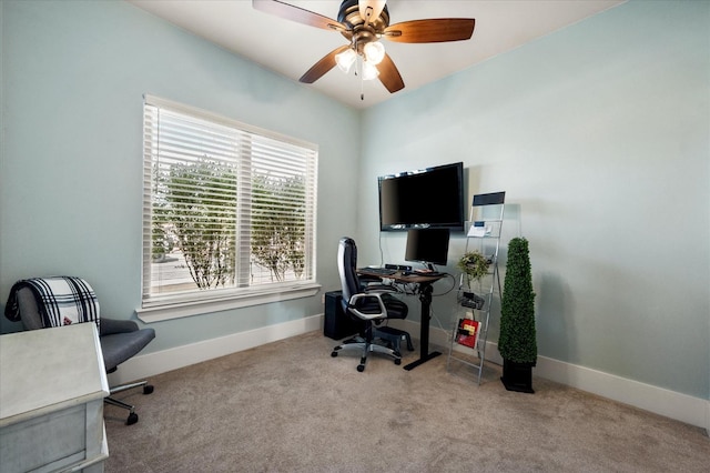 carpeted home office with ceiling fan