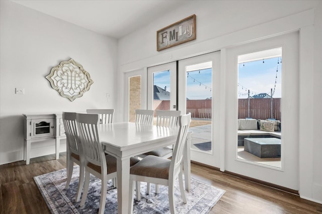 dining area featuring dark hardwood / wood-style floors