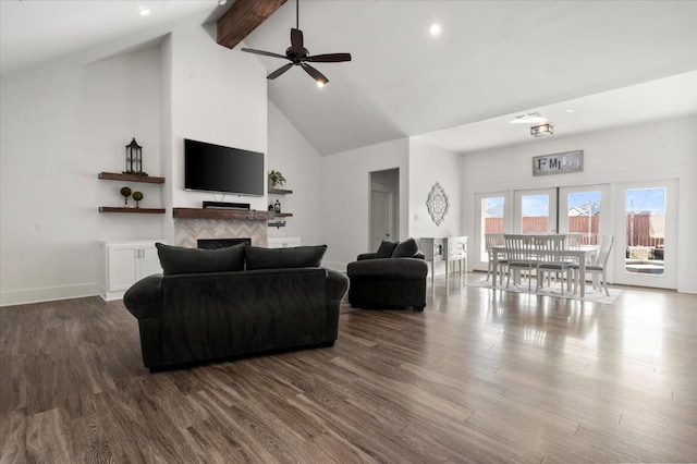 living room with ceiling fan, wood-type flooring, beam ceiling, and high vaulted ceiling