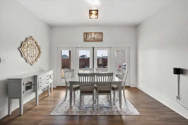 dining room with dark hardwood / wood-style flooring