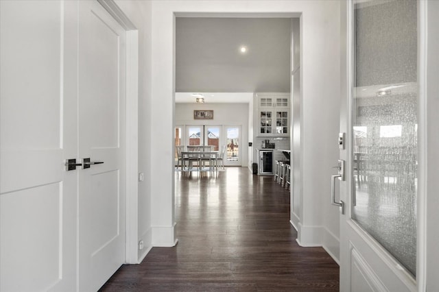 hall with dark wood-type flooring