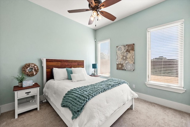 bedroom featuring ceiling fan and light colored carpet