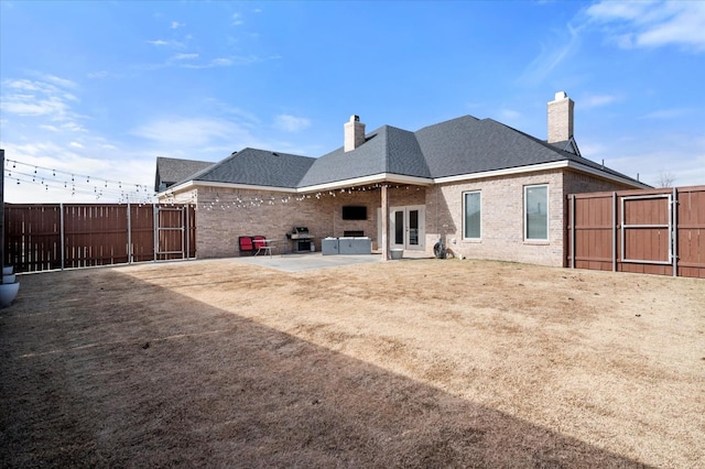 rear view of property with a patio