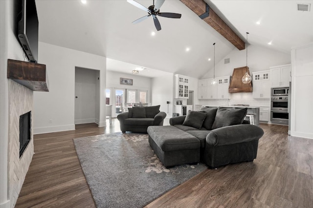 living room featuring beamed ceiling, ceiling fan, dark hardwood / wood-style flooring, and high vaulted ceiling