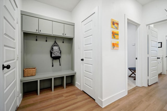 mudroom with light hardwood / wood-style floors