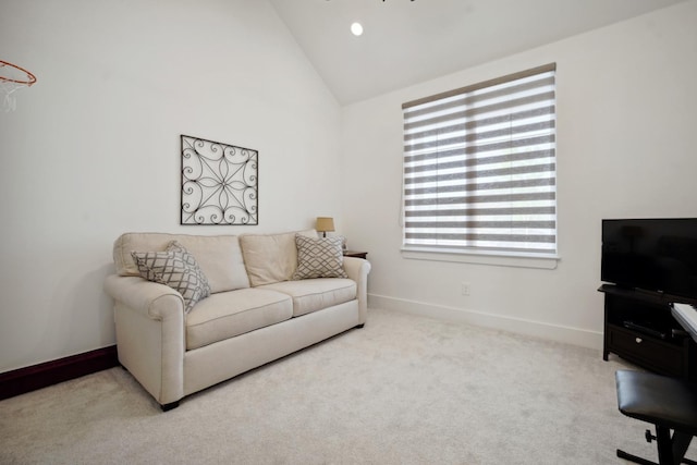 living room featuring light carpet and high vaulted ceiling