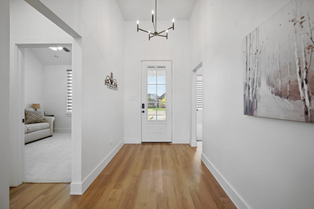 entryway featuring a notable chandelier and light wood-type flooring