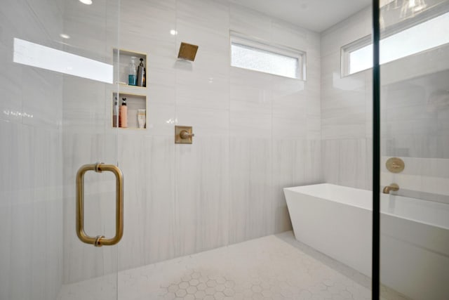 bathroom with shower with separate bathtub