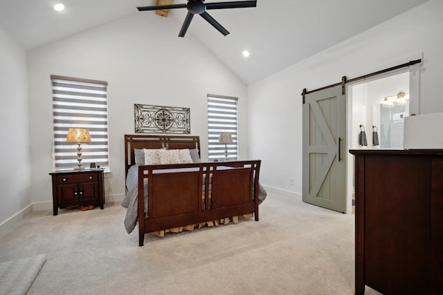 carpeted bedroom featuring ceiling fan, a barn door, and high vaulted ceiling