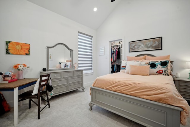 bedroom with light carpet, a walk in closet, high vaulted ceiling, and a closet