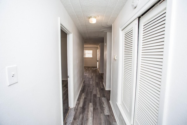 hall featuring dark wood-type flooring