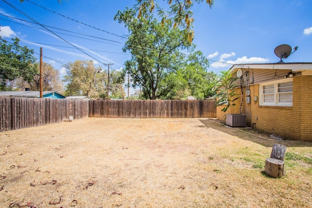 view of yard with central AC