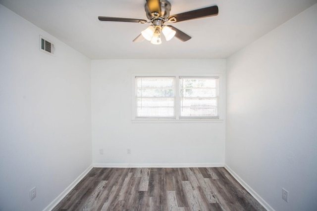 unfurnished room with dark wood-type flooring and ceiling fan