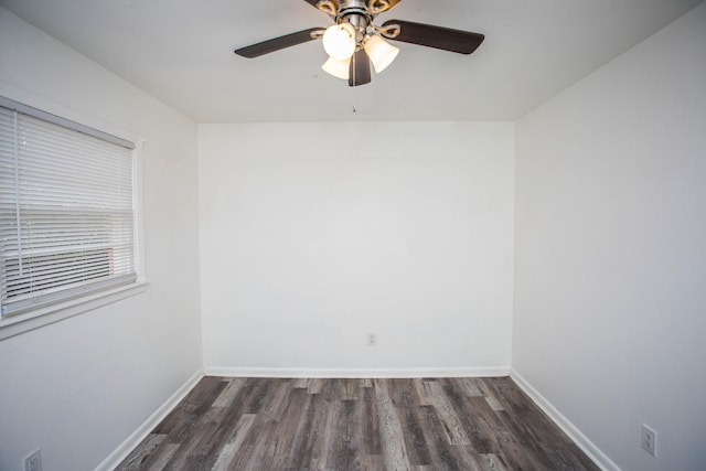 empty room featuring ceiling fan and dark hardwood / wood-style floors