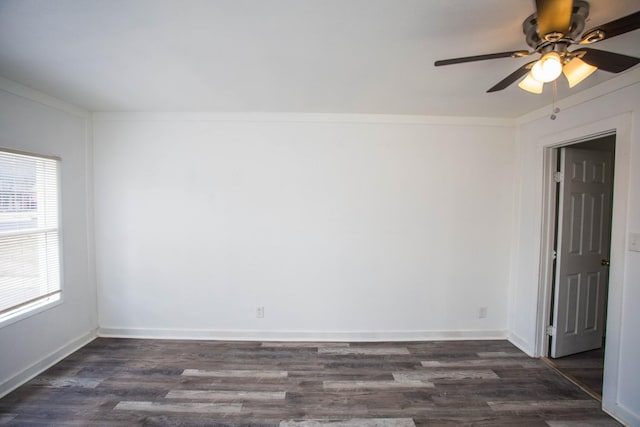 unfurnished room featuring dark wood-type flooring, ceiling fan, and ornamental molding