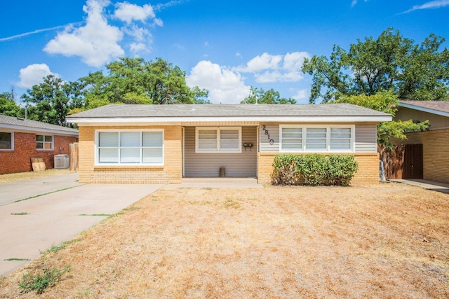 ranch-style home with cooling unit