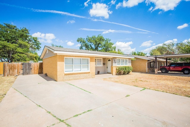 ranch-style house featuring a carport