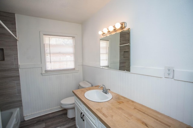 bathroom featuring vanity, toilet, and hardwood / wood-style floors