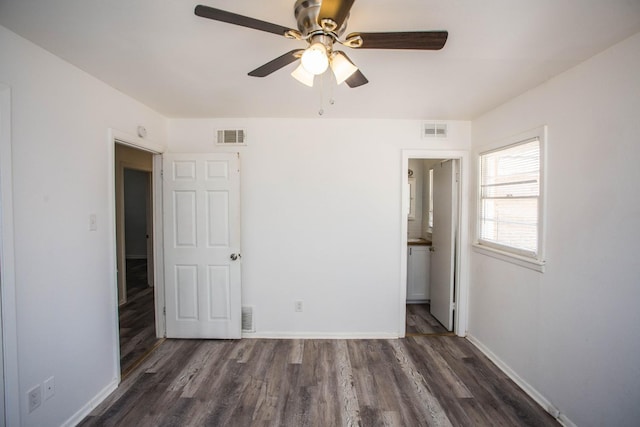 unfurnished bedroom featuring dark hardwood / wood-style floors and ceiling fan