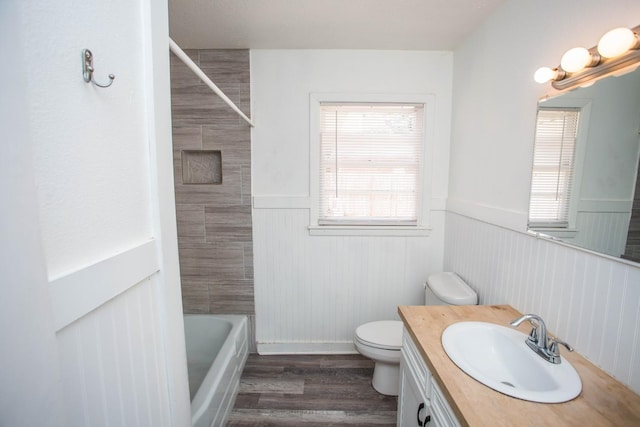 bathroom with vanity, hardwood / wood-style flooring, and toilet